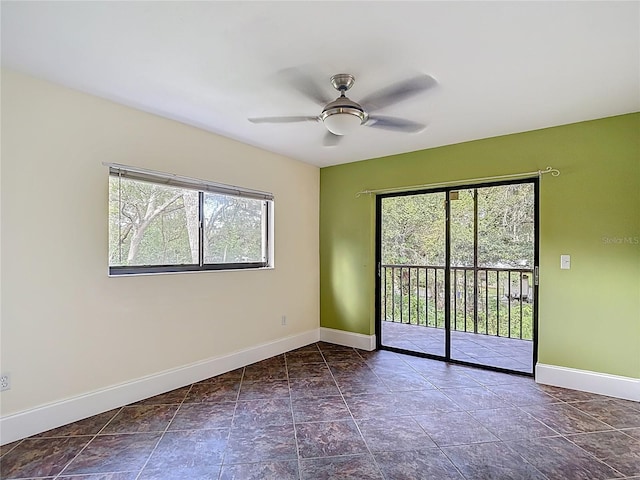 11718 Raintree Village Blvd Unit C, Temple Terrace, FL 33617 - unfurnished room with baseboards and a ceiling fan