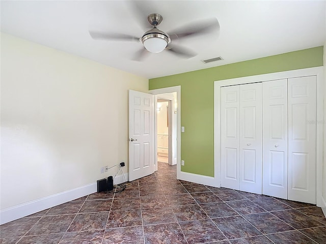 11718 Raintree Village Blvd Unit C, Temple Terrace, FL 33617 - unfurnished bedroom with a closet and a ceiling fan