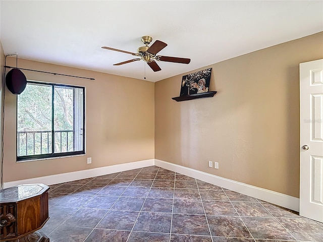 11718 Raintree Village Blvd Unit C, Temple Terrace, FL 33617 - spare room featuring baseboards and a ceiling fan