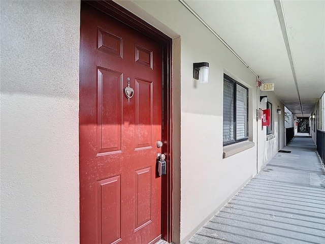 11718 Raintree Village Blvd Unit C, Temple Terrace, FL 33617 - doorway to property featuring stucco siding