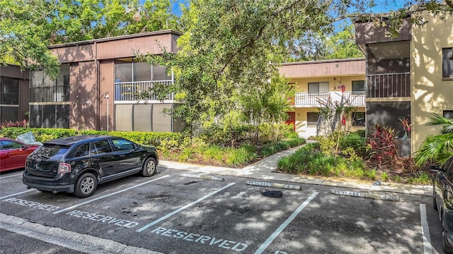 11718 Raintree Village Blvd Unit C, Temple Terrace, FL 33617 - view of building exterior with uncovered parking