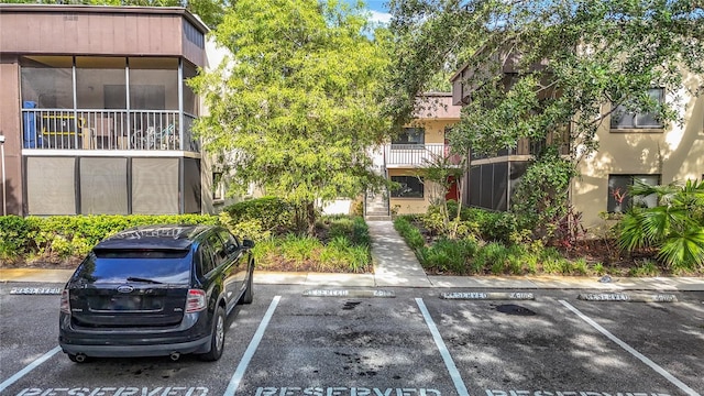 11718 Raintree Village Blvd Unit C, Temple Terrace, FL 33617 - view of building exterior with uncovered parking