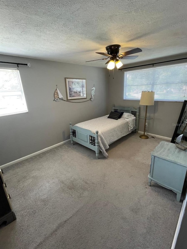 408 Blueberry Ln, Brandon, FL 33510 - bedroom with a textured ceiling, light colored carpet, and a ceiling fan