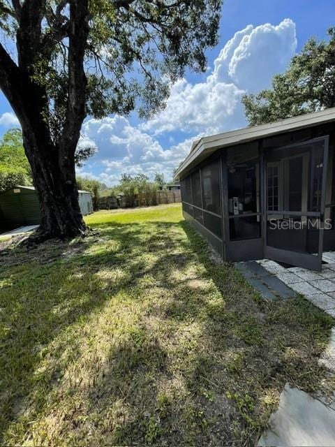 408 Blueberry Ln, Brandon, FL 33510 - view of yard with a sunroom