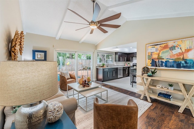 13521 Del Prado Dr S, Largo, FL 33774 - living area featuring ceiling fan, wood finished floors, beam ceiling, and high vaulted ceiling