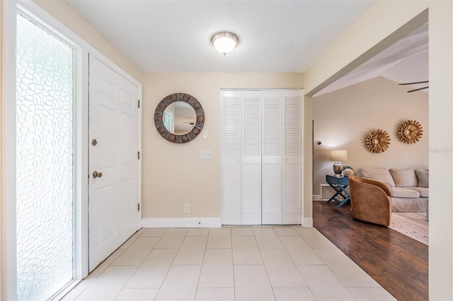 13521 Del Prado Dr S, Largo, FL 33774 - entrance foyer with baseboards and a textured ceiling