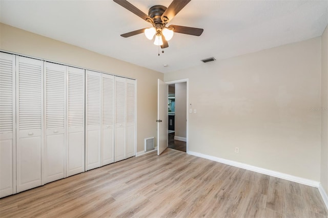 13521 Del Prado Dr S, Largo, FL 33774 - unfurnished bedroom with light wood-style floors, a closet, and ceiling fan