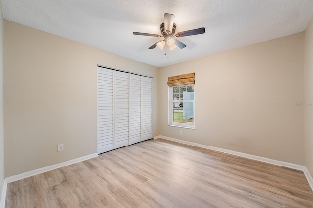 13521 Del Prado Dr S, Largo, FL 33774 - unfurnished bedroom with light wood-style flooring, a closet, and ceiling fan