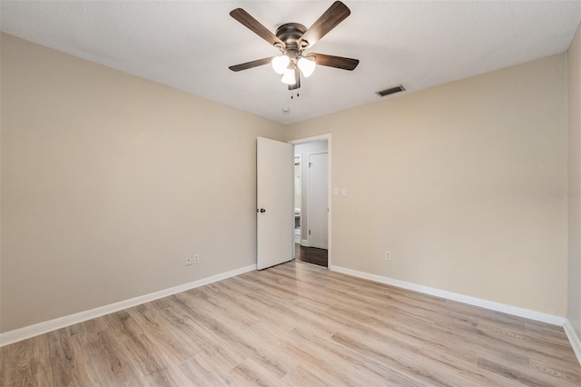 13521 Del Prado Dr S, Largo, FL 33774 - empty room featuring light wood-style floors and ceiling fan