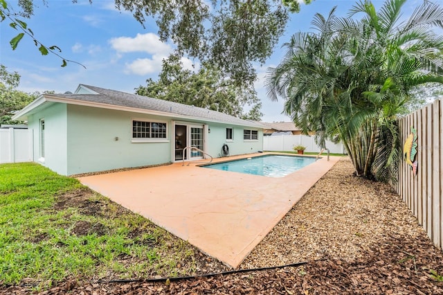 13521 Del Prado Dr S, Largo, FL 33774 - rear view of property with stucco siding, a fenced backyard, and a patio