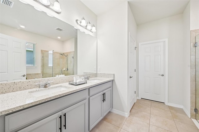 11713 Tetrafin Dr, Riverview, FL 33579 - bathroom featuring double vanity, a stall shower, and tile patterned floors