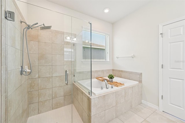 11713 Tetrafin Dr, Riverview, FL 33579 - full bathroom featuring a garden tub, a shower stall, and tile patterned floors