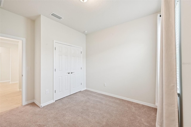 11713 Tetrafin Dr, Riverview, FL 33579 - unfurnished bedroom featuring light carpet and a closet