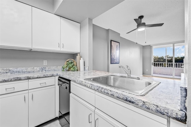 2333 Feather Sound Dr Unit B208, Clearwater, FL 33762 - kitchen with ceiling fan, white cabinets, dishwasher, and a peninsula
