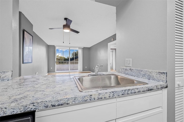 2333 Feather Sound Dr Unit B208, Clearwater, FL 33762 - kitchen with ceiling fan, white cabinetry, and open floor plan