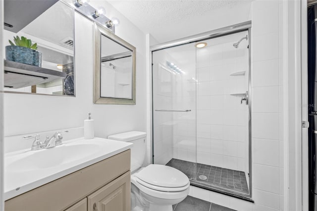 2333 Feather Sound Dr Unit B208, Clearwater, FL 33762 - bathroom with vanity, a stall shower, a textured ceiling, and tile patterned flooring