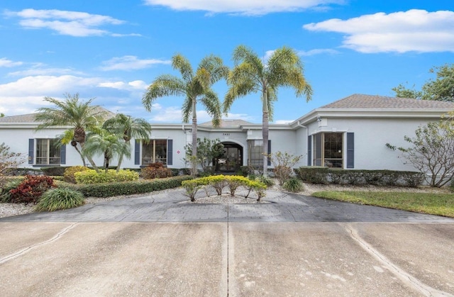 2333 Feather Sound Dr Unit B208, Clearwater, FL 33762 - ranch-style house with stucco siding and driveway