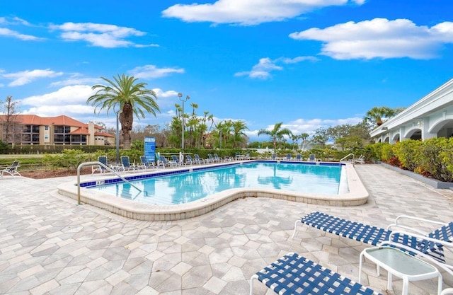 2333 Feather Sound Dr Unit B208, Clearwater, FL 33762 - community pool featuring a patio