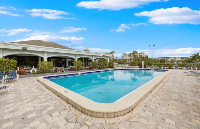 2333 Feather Sound Dr Unit B208, Clearwater, FL 33762 - community pool featuring a patio area