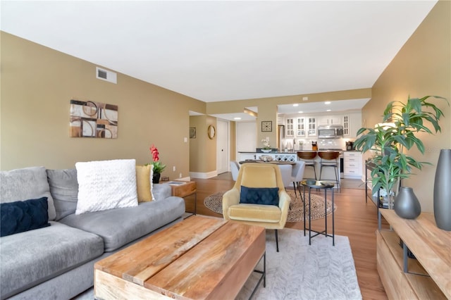 4141 Bayshore Blvd Unit 304, Tampa, FL 33611 - living area with light wood finished floors and recessed lighting