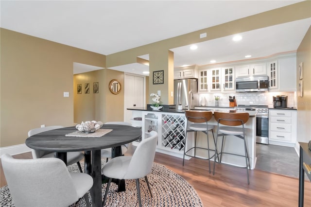 4141 Bayshore Blvd Unit 304, Tampa, FL 33611 - dining room with dark wood-type flooring and recessed lighting