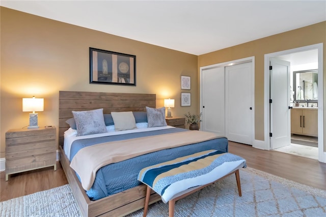 4141 Bayshore Blvd Unit 304, Tampa, FL 33611 - bedroom featuring wood finished floors, a closet, and connected bathroom