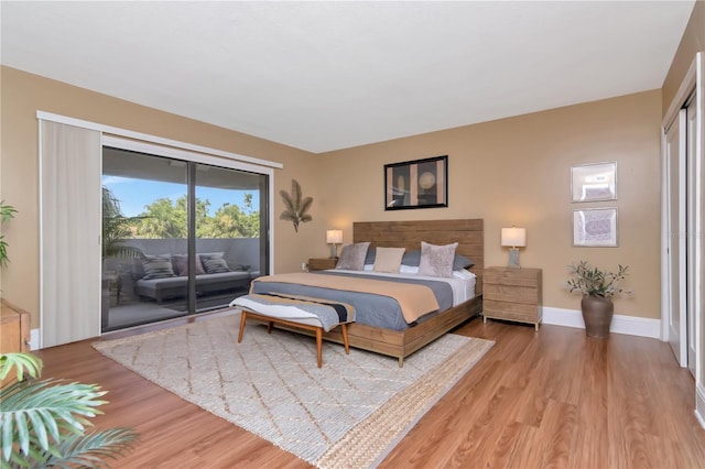 4141 Bayshore Blvd Unit 304, Tampa, FL 33611 - bedroom featuring access to exterior and light wood-style floors