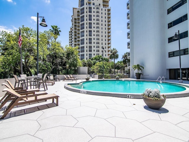 4141 Bayshore Blvd Unit 304, Tampa, FL 33611 - community pool featuring a patio area