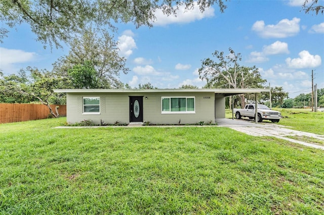 15008 Spokane Rd, Spring Hill, FL 34610 - ranch-style house with driveway and an attached carport