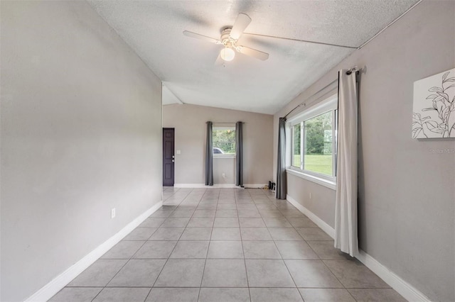15008 Spokane Rd, Spring Hill, FL 34610 - unfurnished room featuring ceiling fan, vaulted ceiling, a textured ceiling, and light tile patterned flooring
