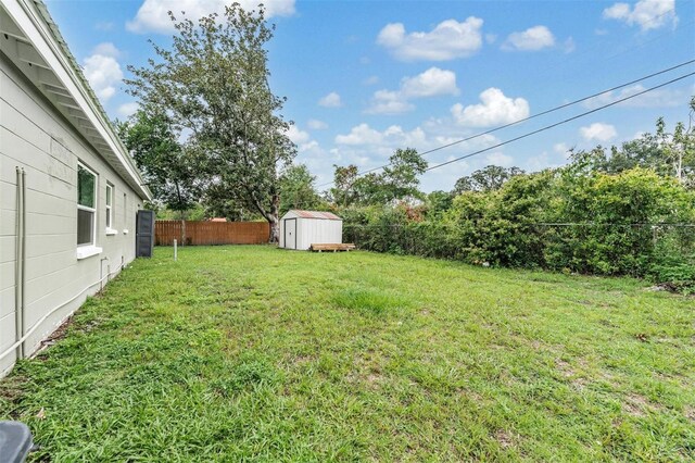 15008 Spokane Rd, Spring Hill, FL 34610 - fenced backyard with a storage shed
