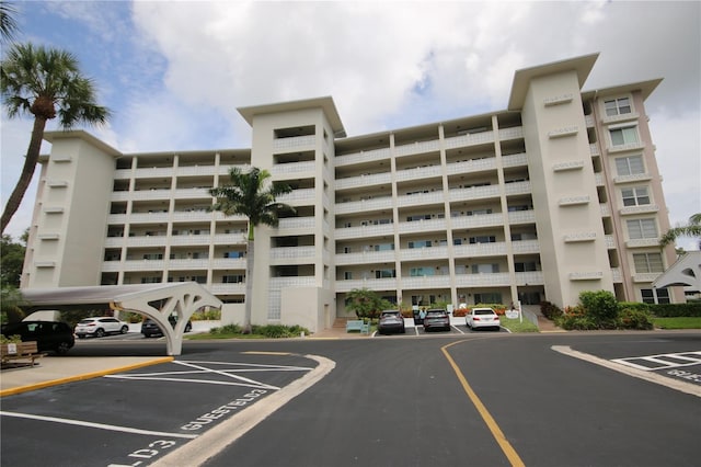 1235 S Highland Ave Unit 5-209, Clearwater, FL 33756 - view of apartment building / complex with uncovered parking