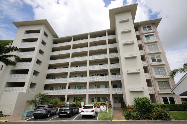 1235 S Highland Ave Unit 5-209, Clearwater, FL 33756 - view of apartment building / complex with uncovered parking