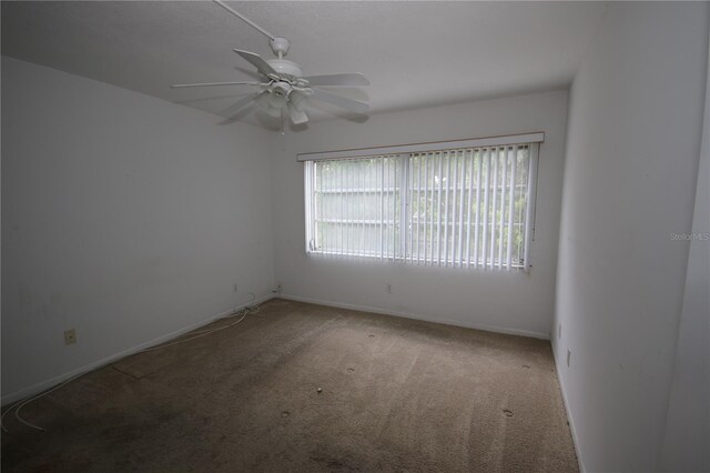 1235 S Highland Ave Unit 5-209, Clearwater, FL 33756 - carpeted spare room featuring a ceiling fan and baseboards