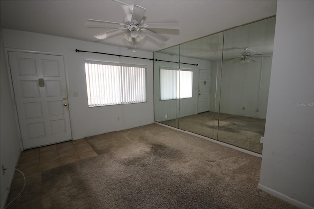 1235 S Highland Ave Unit 5-209, Clearwater, FL 33756 - unfurnished bedroom with carpet floors, a closet, and ceiling fan