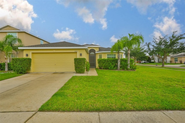 15403 Fire Rock Pl, Ruskin, FL 33573 - view of front facade featuring a garage, a front lawn, stucco siding, and driveway
