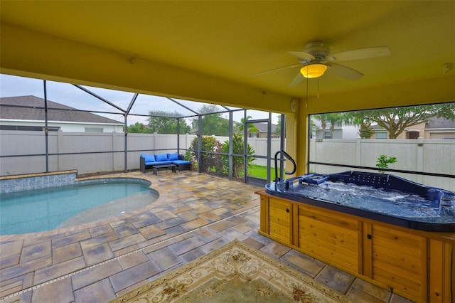 15403 Fire Rock Pl, Ruskin, FL 33573 - view of swimming pool featuring a hot tub, a patio area, a fenced backyard, ceiling fan, and glass enclosure