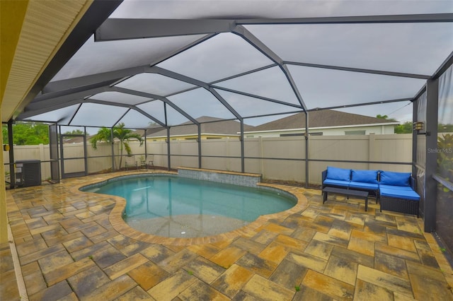 15403 Fire Rock Pl, Ruskin, FL 33573 - view of swimming pool with a patio area, a fenced backyard, an outdoor living space, and a lanai