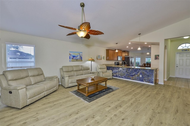 15403 Fire Rock Pl, Ruskin, FL 33573 - living room with light wood-style floors, plenty of natural light, ceiling fan, lofted ceiling, and recessed lighting