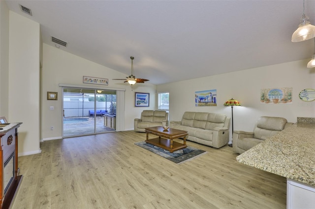 15403 Fire Rock Pl, Ruskin, FL 33573 - living room featuring light wood finished floors, a ceiling fan, and vaulted ceiling