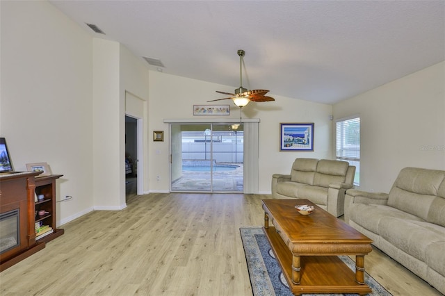 15403 Fire Rock Pl, Ruskin, FL 33573 - living area featuring lofted ceiling, ceiling fan, and light wood finished floors
