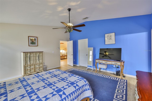 15403 Fire Rock Pl, Ruskin, FL 33573 - bedroom with wood finished floors, vaulted ceiling, and a ceiling fan