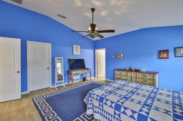 15403 Fire Rock Pl, Ruskin, FL 33573 - bedroom with lofted ceiling, wood finished floors, and a ceiling fan