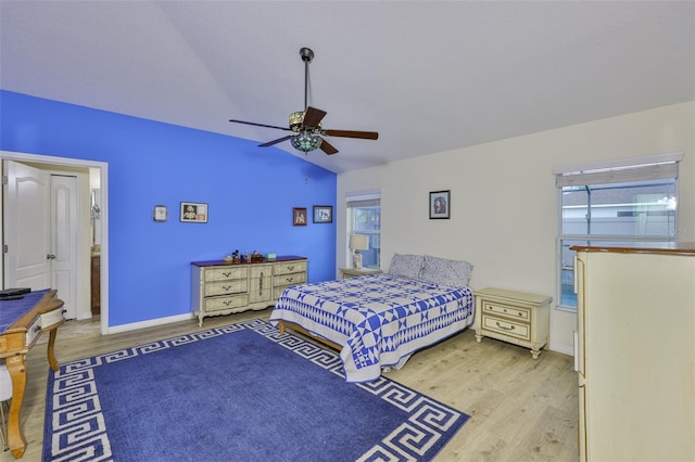 15403 Fire Rock Pl, Ruskin, FL 33573 - bedroom featuring wood finished floors, lofted ceiling, and a ceiling fan