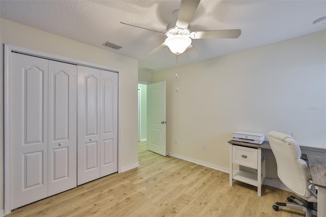 15403 Fire Rock Pl, Ruskin, FL 33573 - office space with light wood-style floors, a ceiling fan, and a textured ceiling