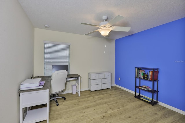 15403 Fire Rock Pl, Ruskin, FL 33573 - office space featuring wood finished floors, ceiling fan, and a textured ceiling