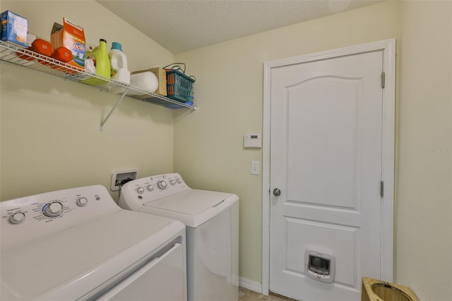 15403 Fire Rock Pl, Ruskin, FL 33573 - washroom with independent washer and dryer and a textured ceiling