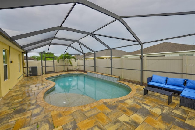 15403 Fire Rock Pl, Ruskin, FL 33573 - view of swimming pool featuring a patio, a fenced backyard, an outdoor hangout area, and glass enclosure