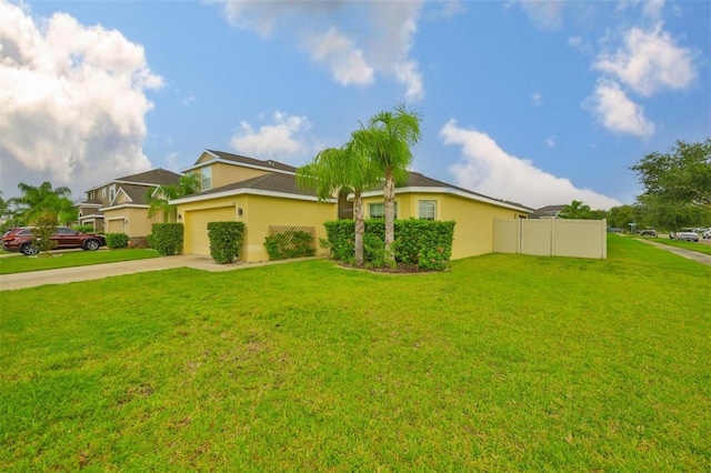 15403 Fire Rock Pl, Ruskin, FL 33573 - view of side of property with concrete driveway, a garage, and stucco siding