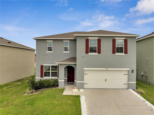 2023 Maple Ridge Dr, Zellwood, FL 32798 - traditional-style home featuring stucco siding, a shingled roof, driveway, a garage, and a front yard
